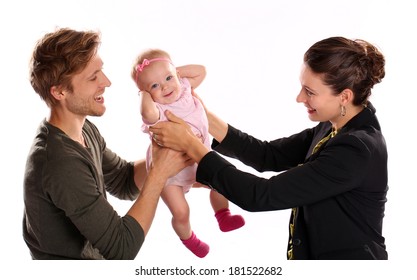 Business Woman And Mother Handing Child To Stay At Home Father 