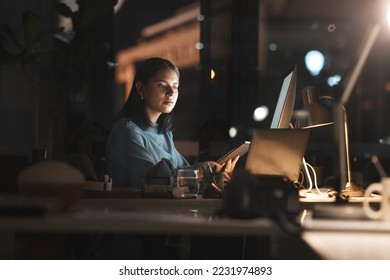 Business woman, in office at night and use tablet with computer planning, thinking and working on digital strategy for financial company. New york, corporate employee and fintech banking security - Powered by Shutterstock