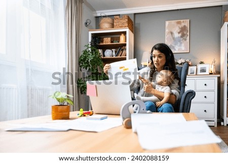Business woman on maternity leave. Mother with newborn baby working from home using laptop. Female professional work at home office remotely video call conference on computer.