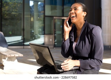 business woman on the phone with a laptop