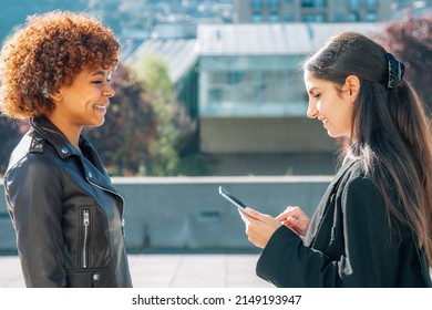business woman on the street with device interviewing