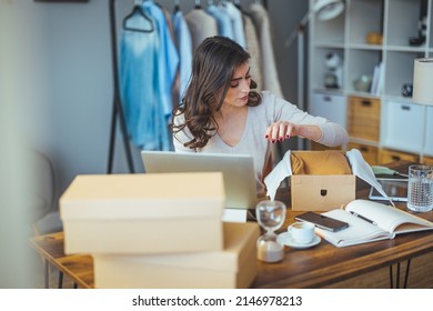 A Business Woman Packs A Shipping Package. The Online Business Owner Prepares The Order And Sends The Delivery Box To The Customer. Work From Home. Home Office.