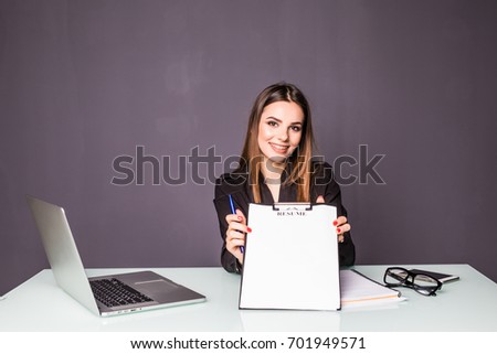 Business woman point to blank clipboard in office