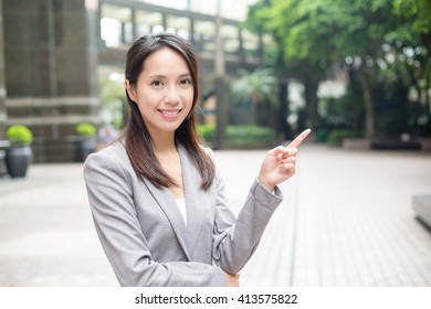 Business woman pointing an idea  - Shutterstock ID 413575822