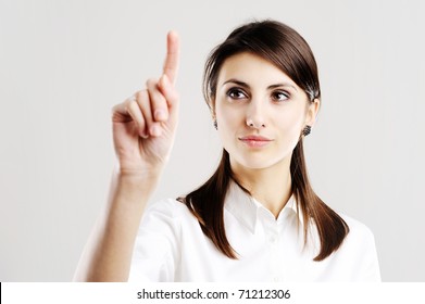 Business Woman Pointing At Something On Screen