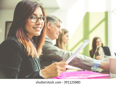 Business woman portrait in an office. woman in an office smiling at camera