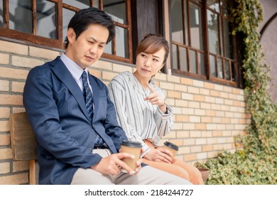 Business Woman Preaching To Subordinate Men