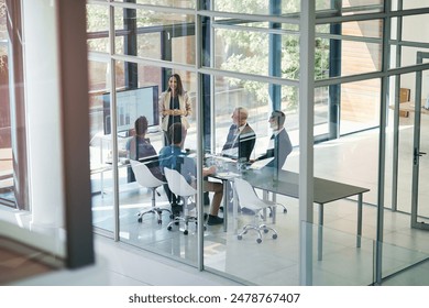 Business woman, presentation and conference room window with collaboration and digital chart. Speaker, financial and accounting data with above and presenter in office with company stats review