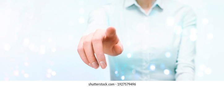 business woman presses on the touch transparent screen with her hand. front view.light blue background - Powered by Shutterstock