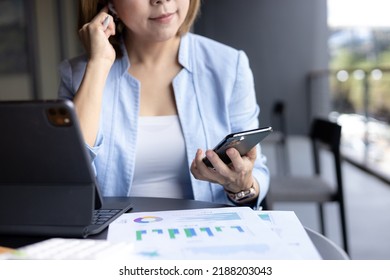 Business Woman Putting On Wireless Headphones, Getting Ready For A Call.