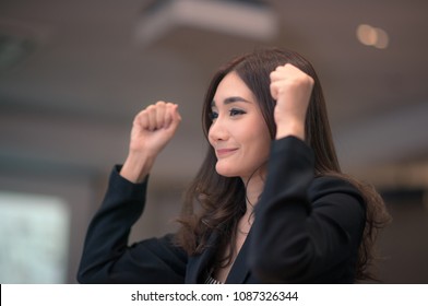 Business Woman Raise Her Hands And Arms As She's So Happy, 