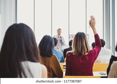 Business woman raising hand for asking speaker for question and answer concept in meeting room for seminar - Shutterstock ID 1177387087