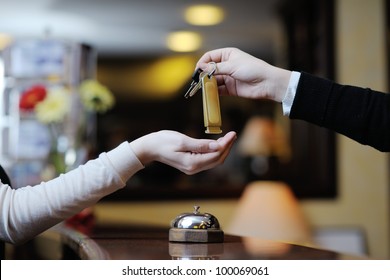 Business Woman  At The Reception Of A Hotel Checking In