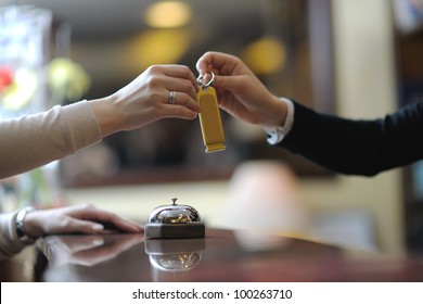 Business Woman  At The Reception Of A Hotel Checking In