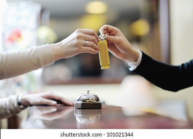 Business Woman  At The Reception Of A Hotel Checking In