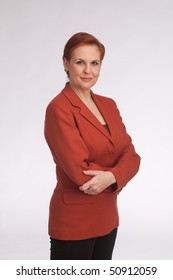 business woman with red sack coat and red hair