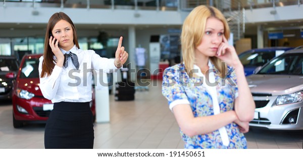 business woman resolving problem of\
dissatisfied customer woman by phone. Selective\
focus.