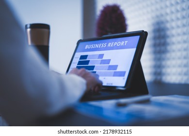 Business Woman Reviewing Data In Financial Charts And Graphs On Wooden Desk In Office And Business Working, Tax, Accounting, Statistics And Analytic Research Concept