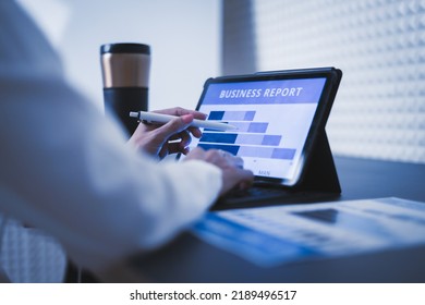 Business woman reviewing data in financial charts and graphs on wooden desk in office and business working, tax, accounting, statistics and analytic research concept - Shutterstock ID 2189496517
