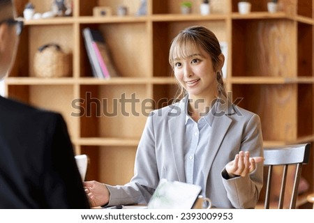 A business woman in a sales position giving an explanation