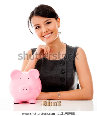 Business woman saving money in a piggybank - isolated over a white background