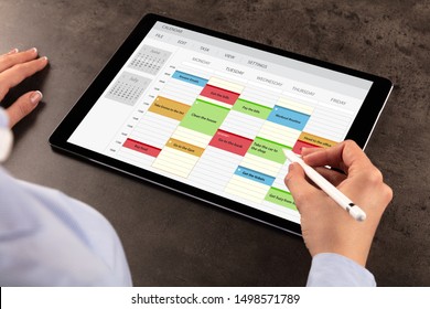 Business Woman Schedule Her Weekly Program On Tablet