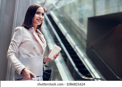 Business Woman She Is Going To Work In Her Morning At The Subway. And She Is Eating Coffee