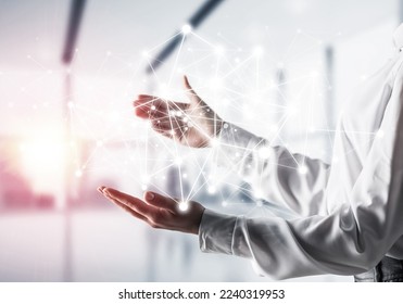 Business woman in shirt keeping white social media network structure in hands with office view and sunlight on background. Mixed media. - Shutterstock ID 2240319953