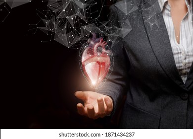 Business Woman Showing Heart On Dark Background.