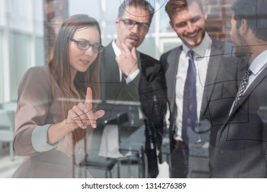 Business Woman Showing Information On A Glass Board