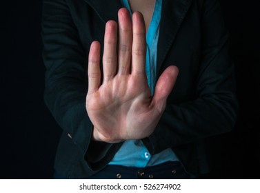 Business woman showing STOP gesture
