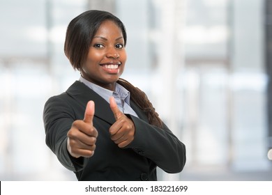 Business woman showing thumbs up