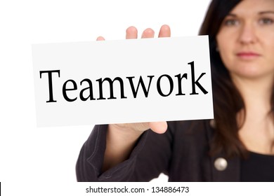 Business Woman with sign and the word Teamwork / teamwork