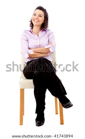 business woman sitting on a chair isolated over a white background