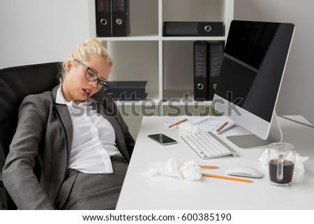Business woman sleeping in the office
