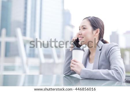 business woman smile speak smart phone and hold coffee cup in office, asian beauty