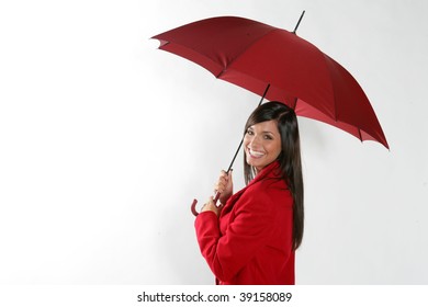 Business Woman Standing Under Red Umbrella