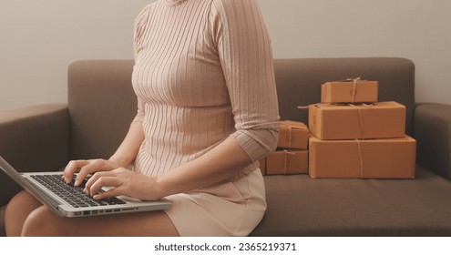 Business woman start up small business entrepreneur SME success .freelance woman working at home with Online Parcel delivery. SME and packaging deliveryconcept - Shutterstock ID 2365219371