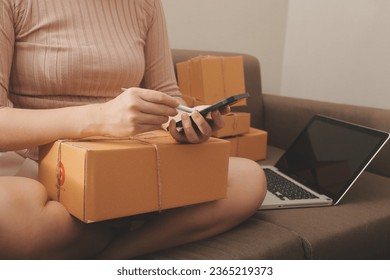 Business woman start up small business entrepreneur SME success .freelance woman working at home with Online Parcel delivery. SME and packaging deliveryconcept - Shutterstock ID 2365219373
