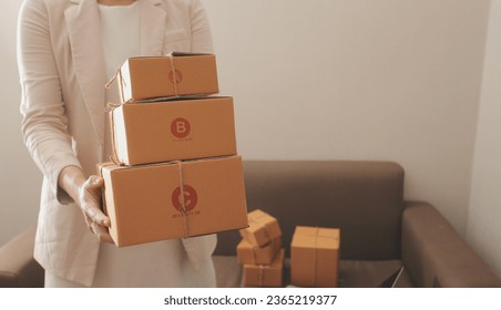 Business woman start up small business entrepreneur SME success .freelance woman working at home with Online Parcel delivery. SME and packaging deliveryconcept - Shutterstock ID 2365219377