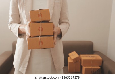 Business woman start up small business entrepreneur SME success .freelance woman working at home with Online Parcel delivery. SME and packaging deliveryconcept - Shutterstock ID 2365219379