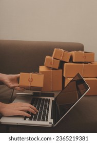 Business woman start up small business entrepreneur SME success .freelance woman working at home with Online Parcel delivery. SME and packaging deliveryconcept - Shutterstock ID 2365219381
