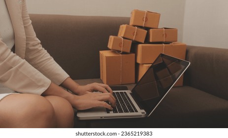 Business woman start up small business entrepreneur SME success .freelance woman working at home with Online Parcel delivery. SME and packaging deliveryconcept - Shutterstock ID 2365219383