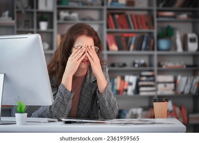 Business woman with stressed and working on pc - Shutterstock ID 2361959565