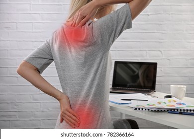 Business Woman Suffering From Back Pain. Incorrect Sitting Posture Problems. Pain Relief , Chiropractic Concept.