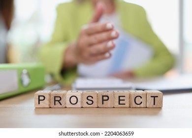 Business woman in business suit extends hand for handshake and text prospect closeup. Perspective business and commercial business agreements with partners - Shutterstock ID 2204063659