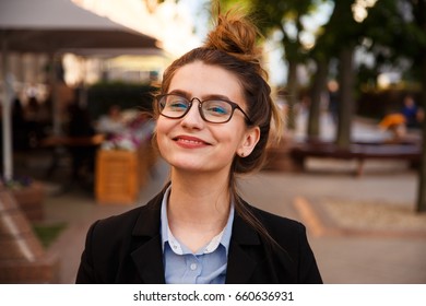 Business woman in suit portrait during travel for company meeting outdoor brunette with glasses - Shutterstock ID 660636931