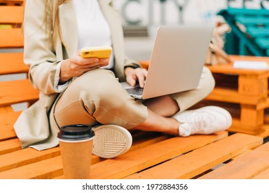Business Woman In Suit Texting Message On Cellphone And Working At Laptop Sit Down On Bench Outside. Happy Student Lady Girl Having A Video Chat With Phone, Distance Learning And Online Education.