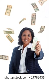 Business Woman Surrounded By Falling Money Holding A Bill