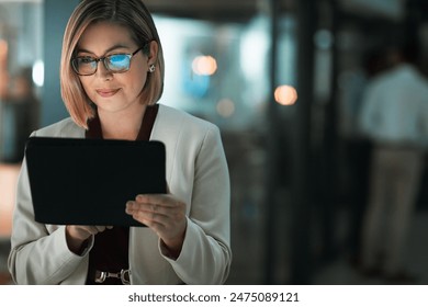 Business woman, tablet and typing in office for corporate communication, internet research and networking. Female person, technology and working late night for project planning and company email
